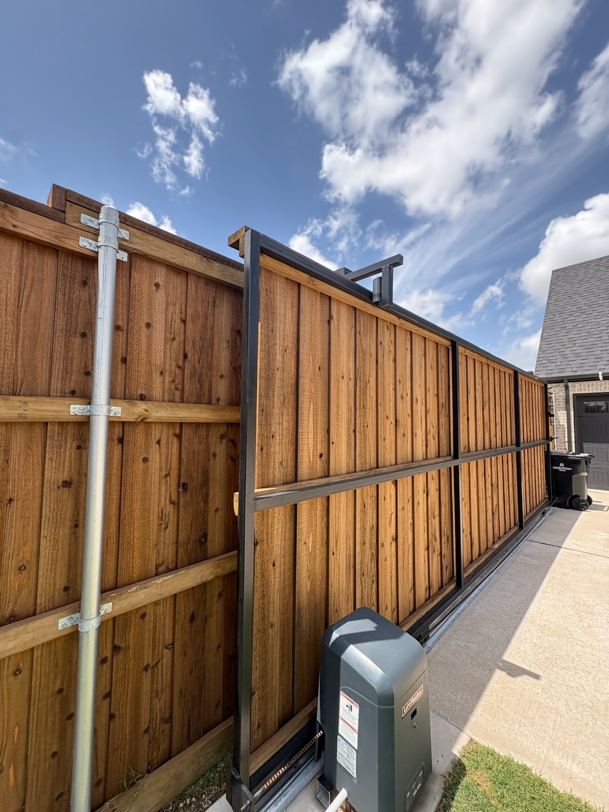 Cedar sliding gate with steel frame and LiftMaster opener
